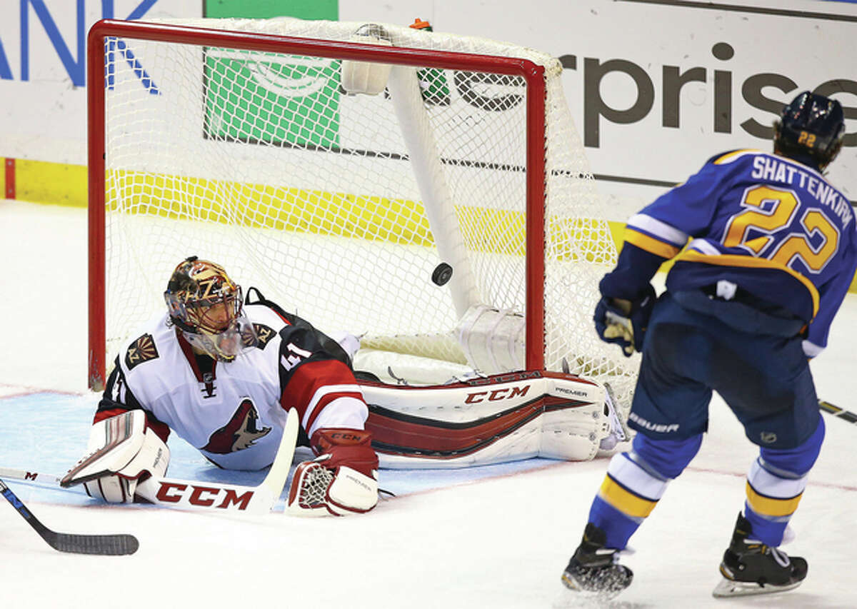 Blues defenseman Kevin Shattenkirk (right) scores a goal against Coyotes goalie Mike Smith during the third period of the Blues’ 4-1 victory Tuesday night in St. Louis.