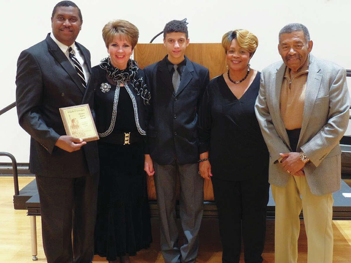 Pictured from left to right, Rev. Michael Logan, Carol Logan, Micah Logan, President of Miles Davis Memorial Statue Patricia King, Overseer Ed Gray at the Elijah P. Lovejoy Awards Banquet at Lewis and Clark Community College.