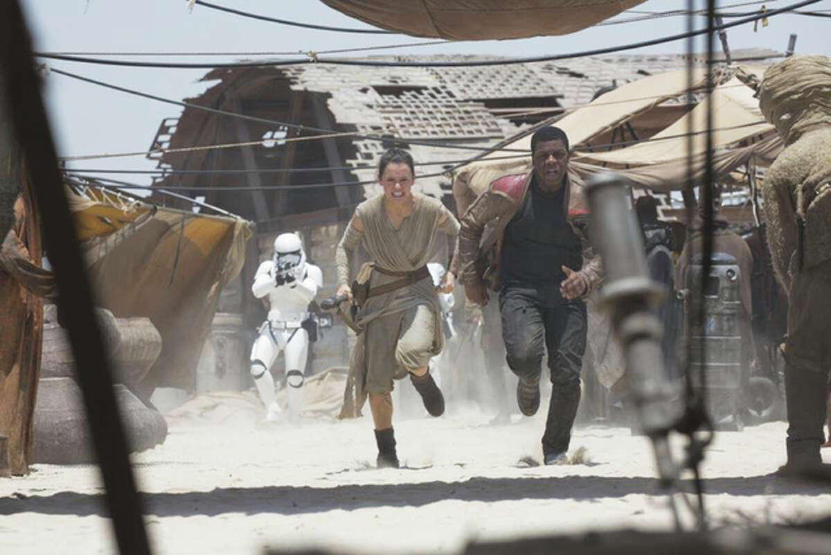 Daisy Ridley and John Boyega in “Star Wars: The Force Awakens.”