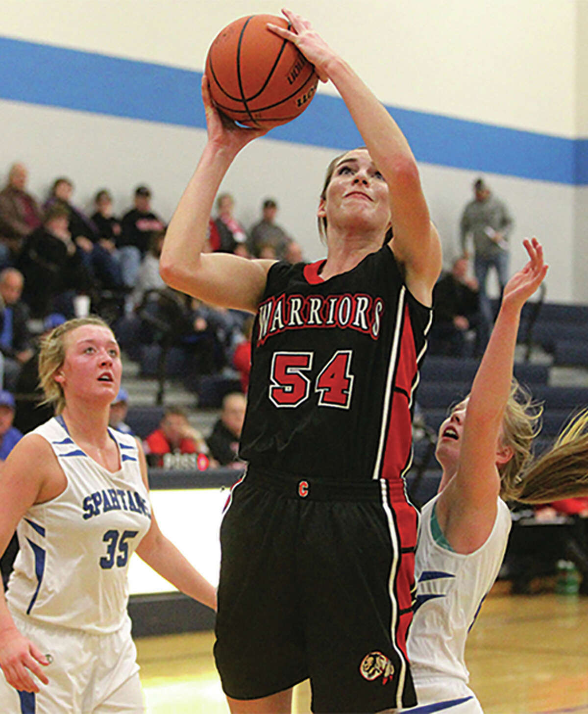 Calhoun junior Grace Baalman (54) goes up for two points in Monday win at North Greene. A two-time all-stater, Baalman leads the 9-1 Warriors with 14.5 points and 8.2 rebounds per game.