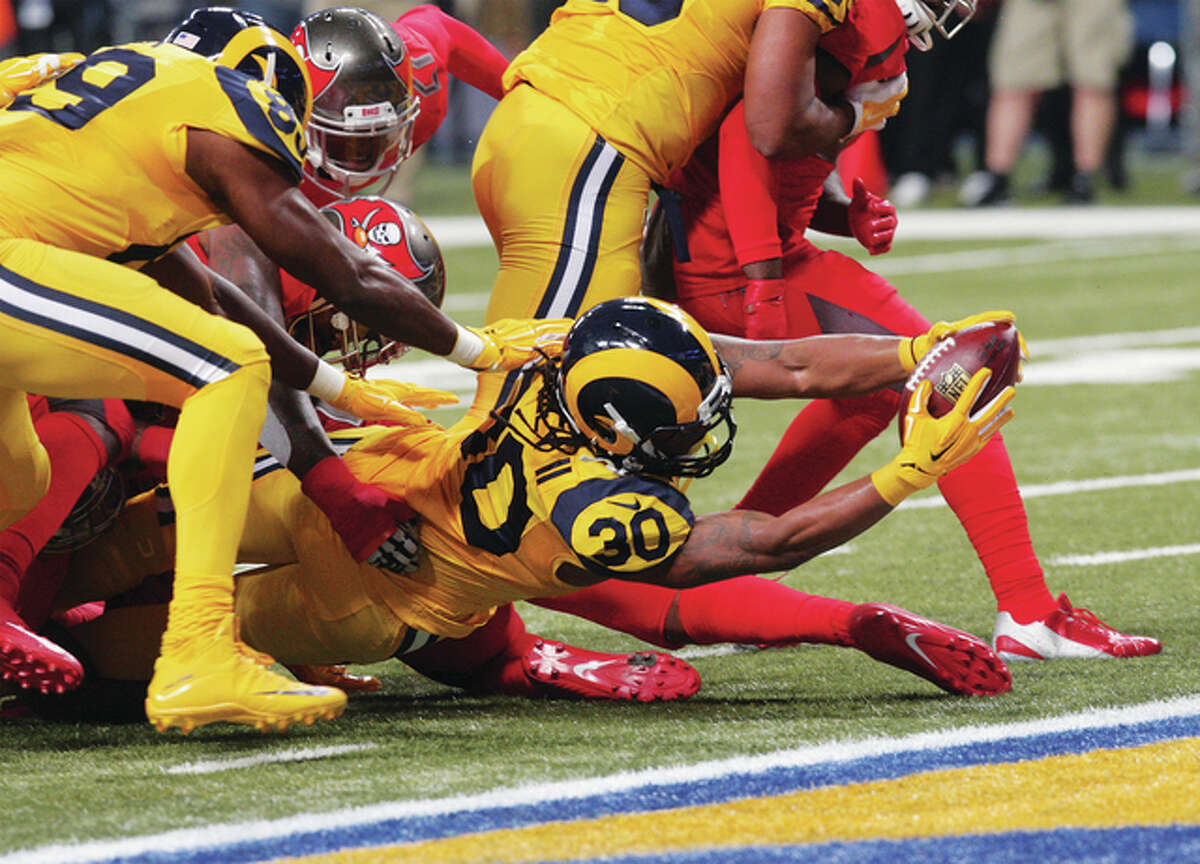 Rams running backTodd Gurley stretches out with the ball for a touchdown late in the first half Thursday night against Tampa Bay at the Edward Jones Dome in St. Louis. Rams downed the Buccaneers 31-23.