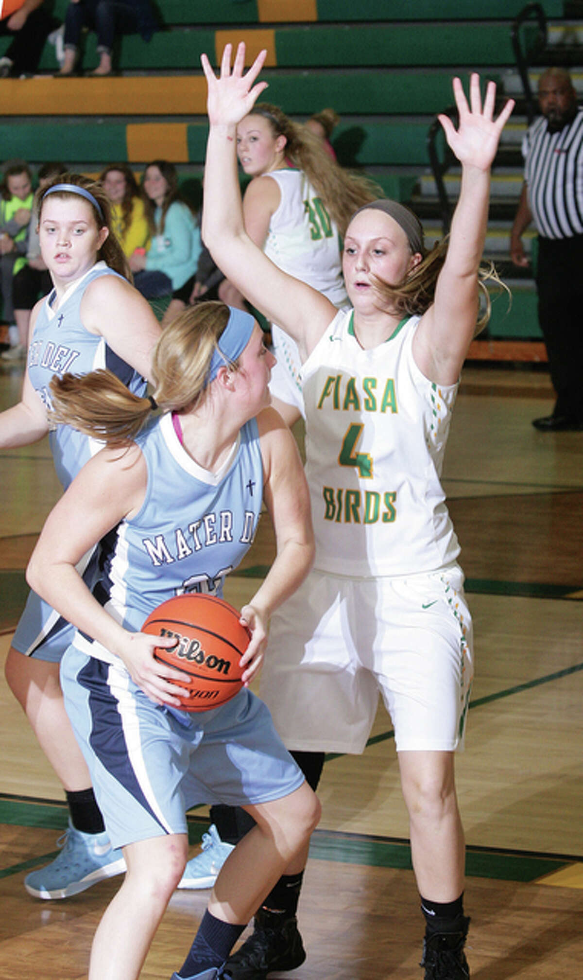Southwestern’s Karlie Greene (right) defends while Breese Mater Dei’s Myah Beckmann looks for help during a Piasa Birds win Dec. 12 in Piasa. The Birds take an 11-3 record and seven-game winning streak into this week’s Jersey Tournament.
