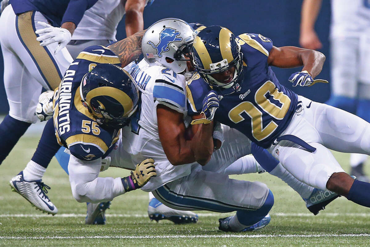 Detroit Lions running back Ameer Abdullah (middle) is tackled by Rams linebacker James Laurinaitis (55) and cornerback Lamarcus Joyner (20) during a Rams’ 21-14 win Dec. 13 at the Edward Jones Dome in St. Louis. The Rams close their season Sunday against the 49ers in San Francisco.