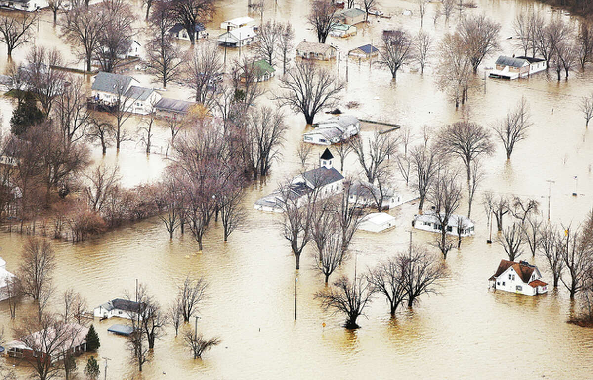 An aerial photo taken of the community of West Alton, Missouri, last Friday shows it underwater. Water levels, while dropping rapidly other places, are dropping slowly in West Alton because once floodwaters are in, they are trapped by the levee systems that are supposed to protect the town from the Missouri River on one side and the Mississippi River on the other.