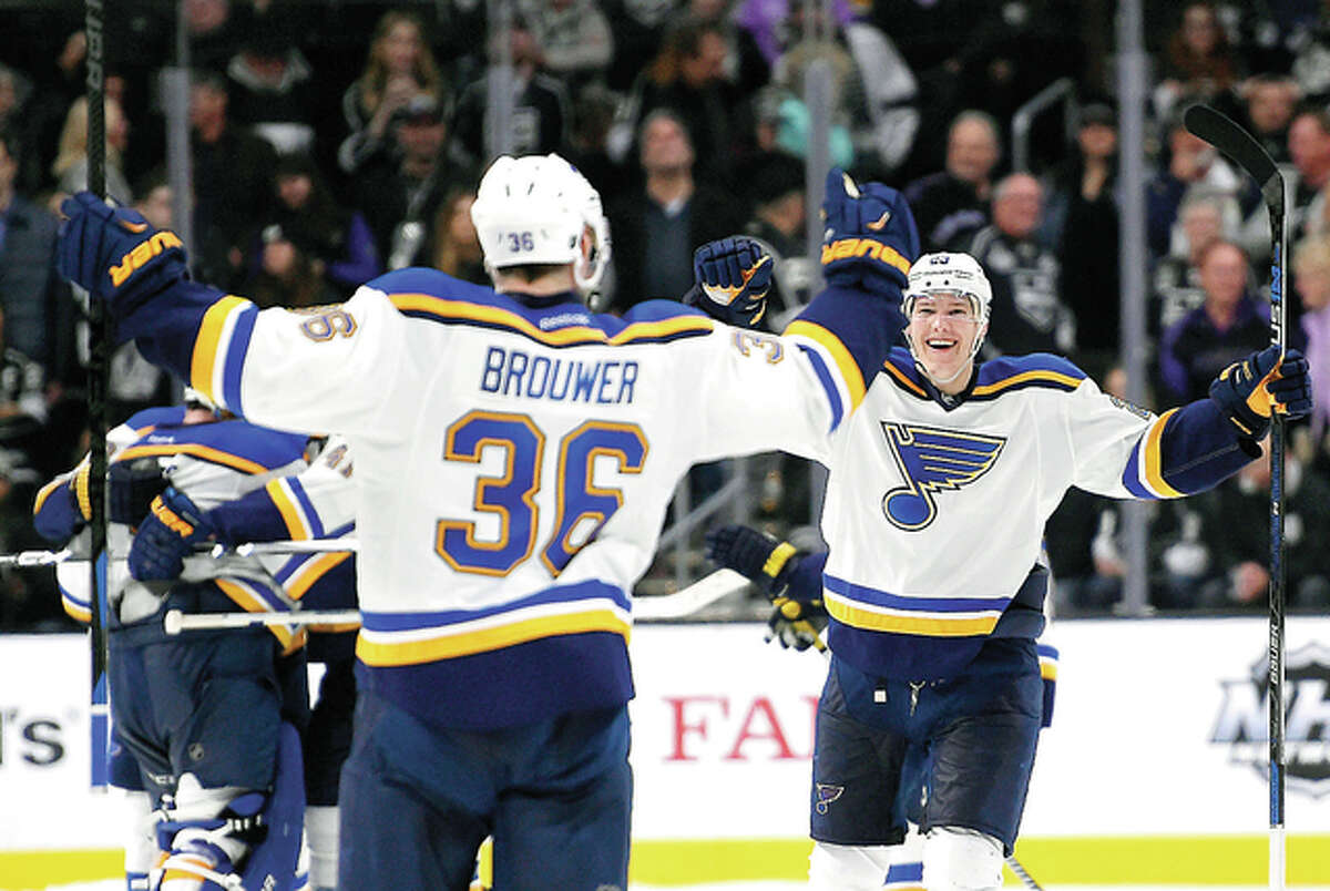 Blues right winger Troy Brouwer, left, celebrates his game-winning overtime shootout goal with teammate Dmitrij Jaskin Saturday in Los Angeles. The Blues won 2-1.