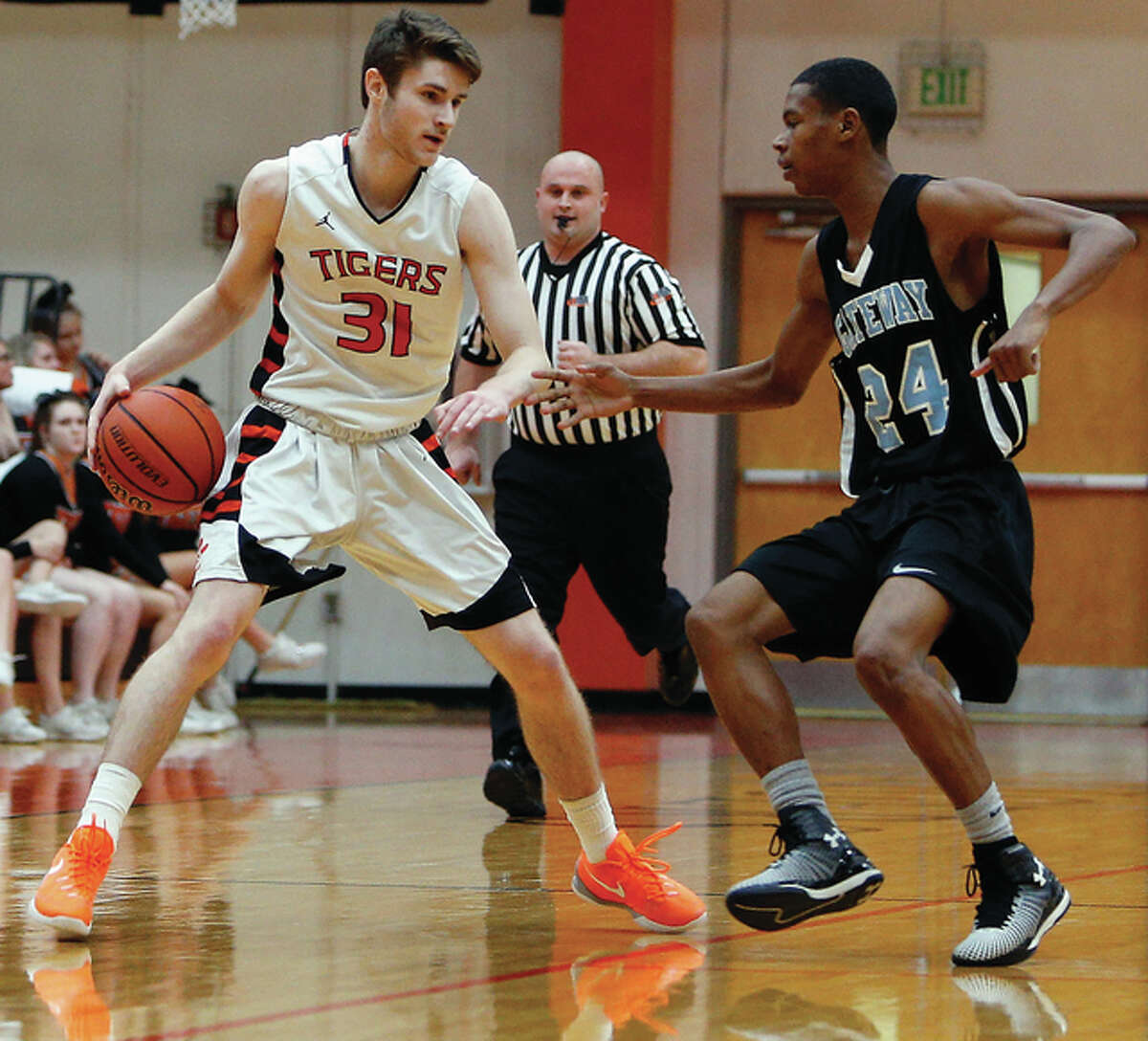 Edwardsville’s Oliver Stephen (left) handles the basketball while Gateway STEM’s David Borland defends during a nonconference boys basketball game Monday night at Lucco-Jackson Gym in Edwardsville.