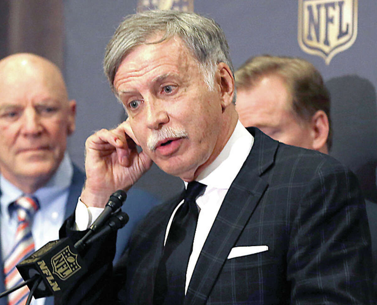 Rams owner Stan Kroenke talks to the media after team owners voted Tuesday to allow the Rams to move to a new stadium just outside Los Angeles, and the San Diego Chargers will have an option to share the facility. Houston Texans owner Bob McNair stands to his left.