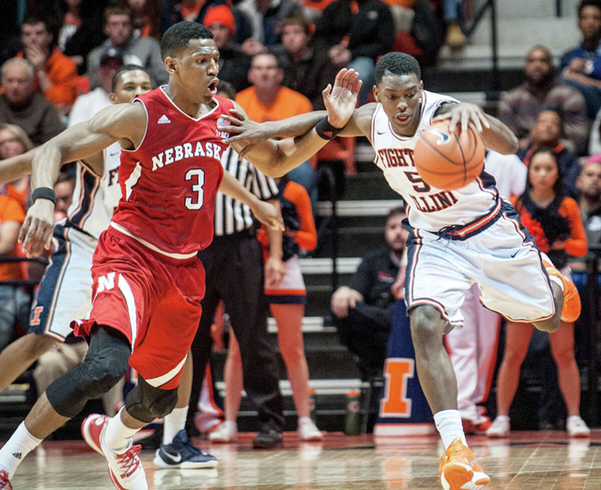 Illinois guard Jalen Coleman-Lands, right, tries to regain control of a loose ball as Nebraska’s Andrew White III closes in during Saturday in Champaign.