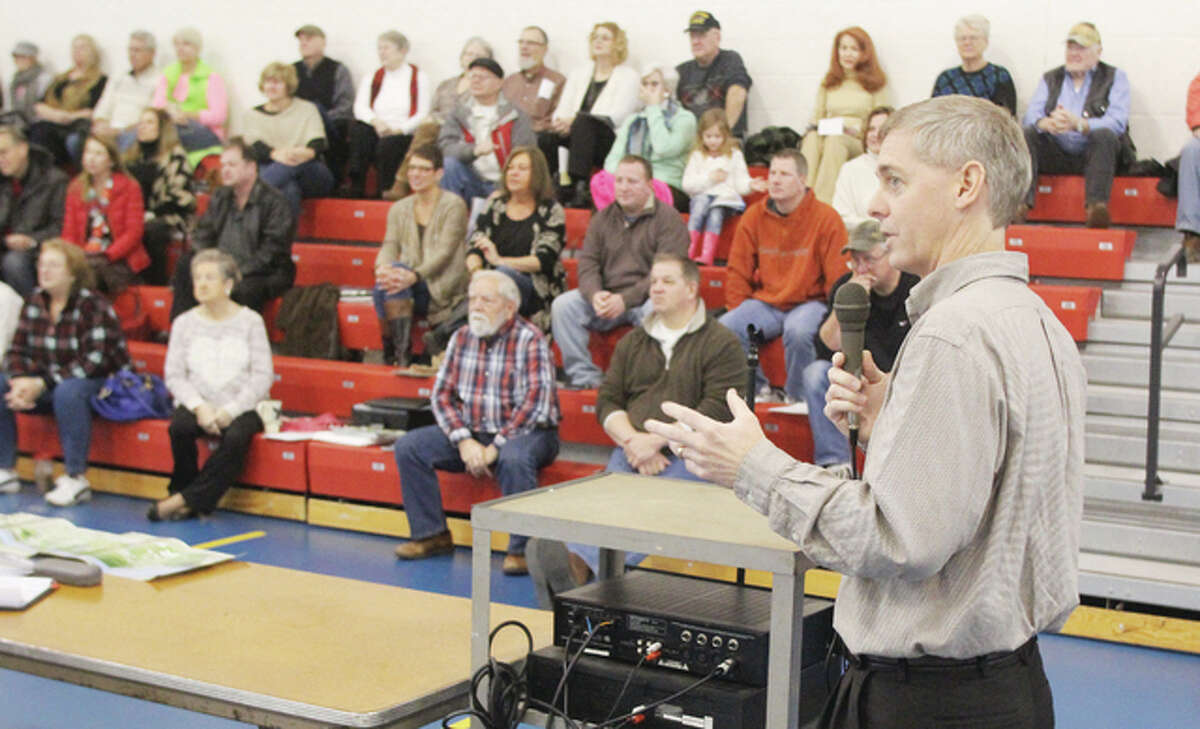 Executive Director Dennis Wilmsmeyer, of America’s Central Port District, speaks at a Saturday morning public meeting at Grafton Elementary School set up by Grafton United, a grassroots civic group formed recently to support keeping Grafton within the port district.