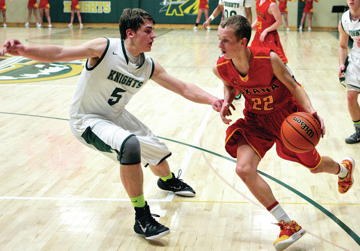 Metro East Lutheran’s Jason Johnson (left) defends the drive of Roxana’s Zach Golenor during a game last season at Hooks Gym in Edwardsville. The Knights and Shells — and Johnson and Golenor — clash again Tuesday night at Milazzo Gym in Roxana.