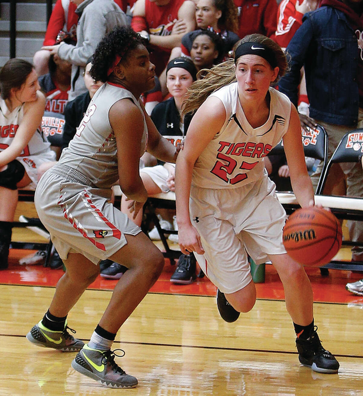 Edwardsville sophomore Kate Martin (left), shown driving past Alton’s Cri’Shonna Hickman during a Tigers win Jan. 15 in Edwardsville, made two free throws with two seconds left Tuesday night to give the Tigers a 49-47 win over the host Lancers at Belleville East.