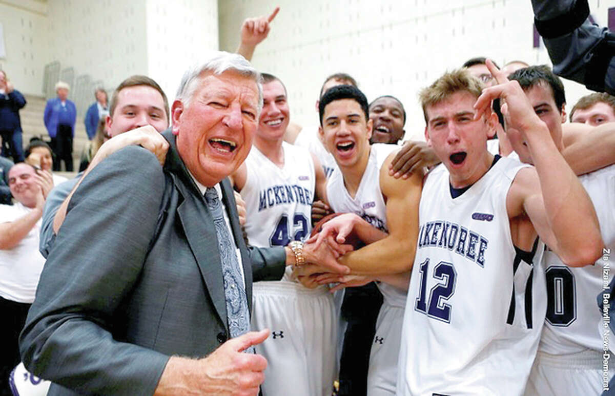 McKendree players celebrate with coach Harry Statham following Thursday night’s victory over Wisconsin-Parkside.