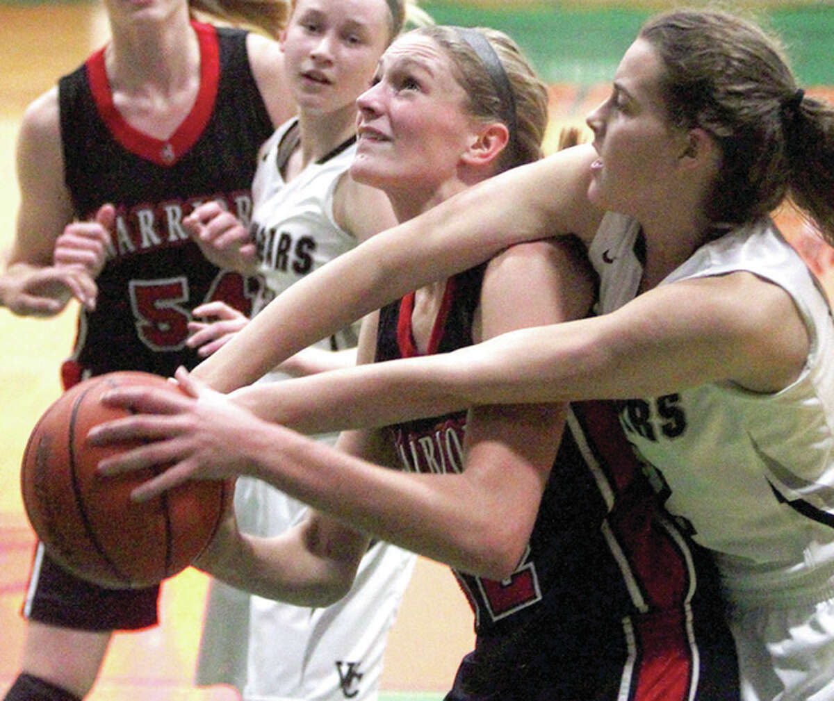 Calhoun’s Grace Baalman gets fouled on her way to the basket during a game against West Central at the Carrollton Lady Hawk Invitational Thursday night.