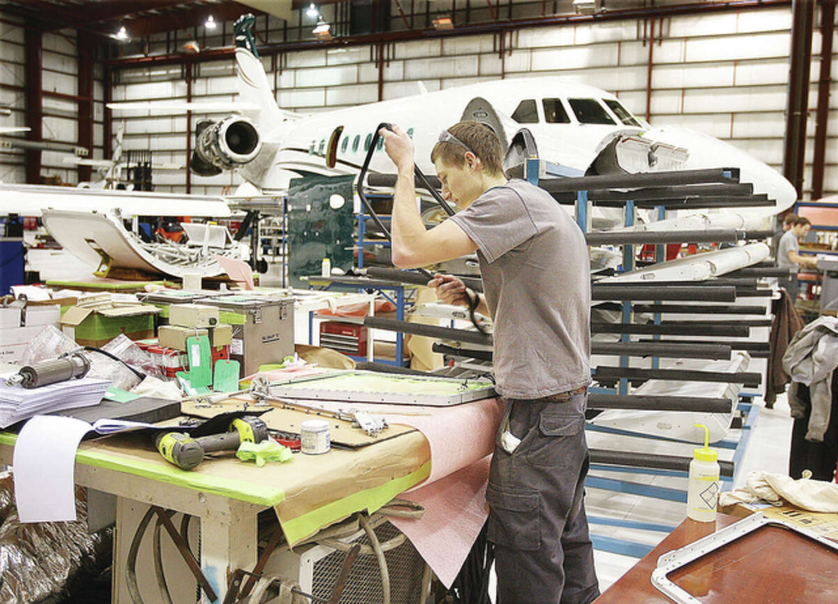 There did not seem to be a shortage of work to go around Friday in one of the massive aircraft hangars where several jets were undergoing repairs at West Star Aviation at St. Louis Regional Airport in East Alton near Bethalto.