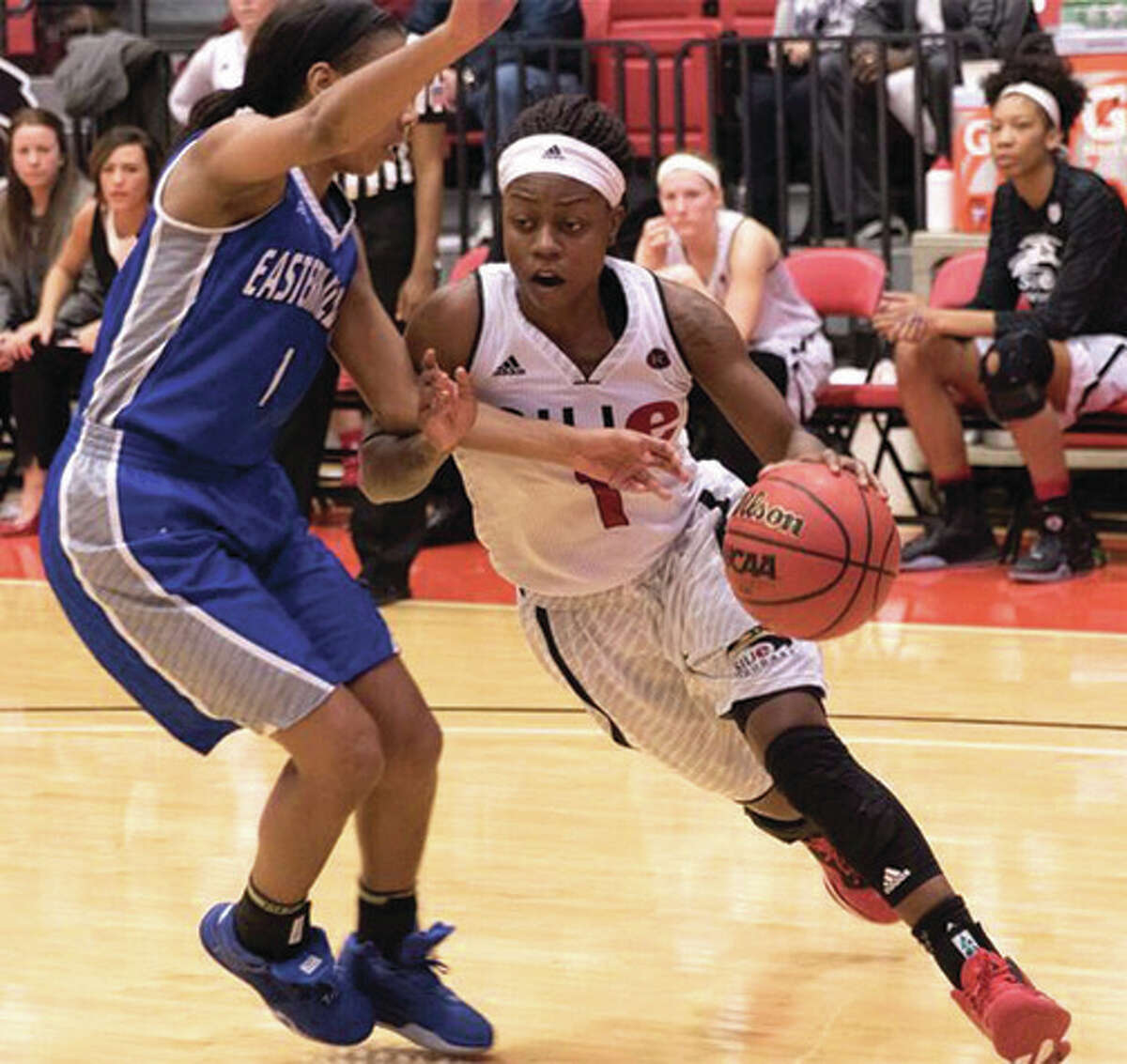 SIUE’s CoCo Moore (right) drives on Eastern Illinois’ Phylicia Johnson during the Cougars’ OVC victory Saturday afternoon at Vadalabene Center in Edwardsville.