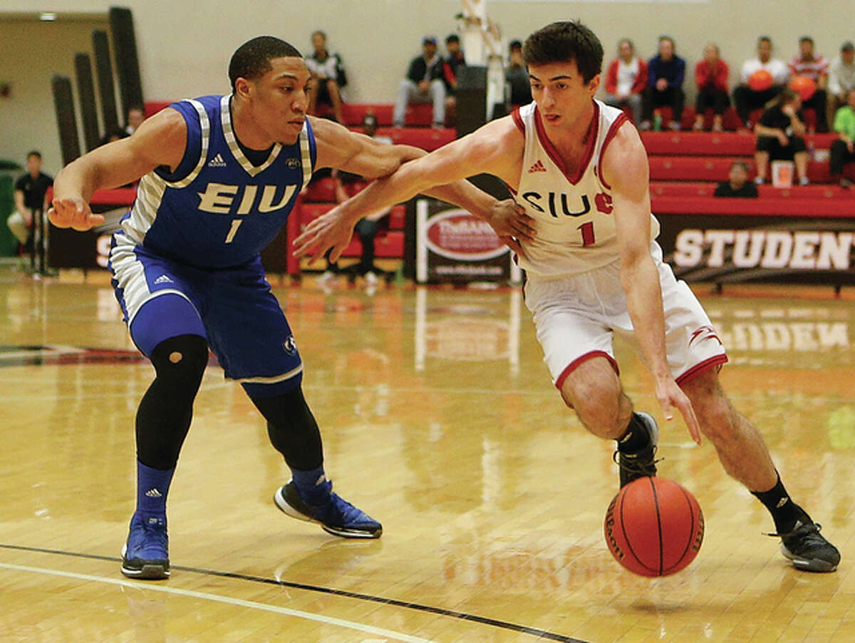 SIUE’s Burak Eslik (1) drives on Eastern Illlinois’ Demetrius McReynolds during an Ohio Valley Conference men’s basketball game Saturday night at Vadalabene Center in Edwardsville