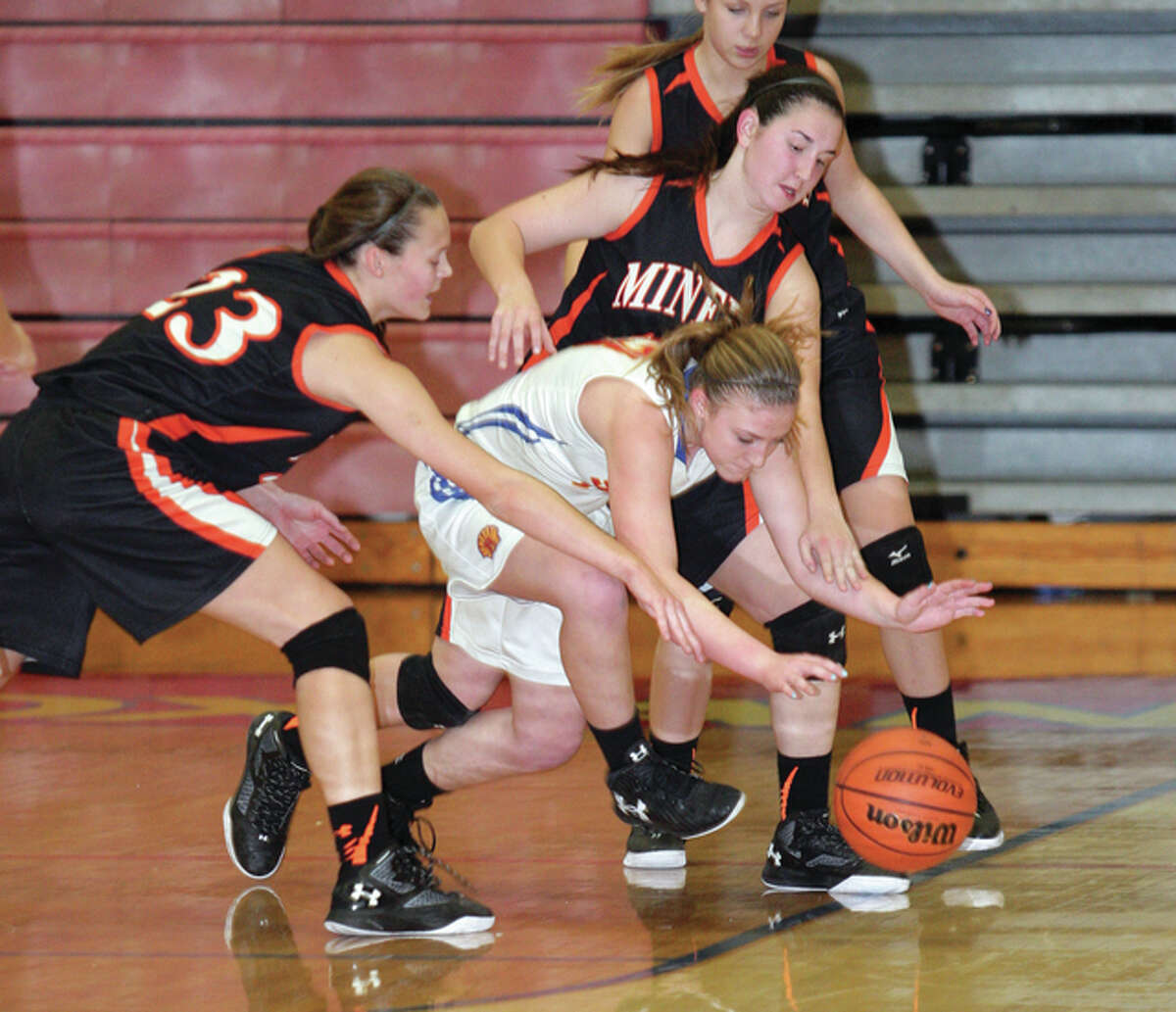 Gillespie’s Bailey Jarman (left) and Paige Niemeyer apply defensive pressure against Roxana’s Lindsey Scroggins (middle) during a Miners South Central Conference girls basketball victory Jan. 11 at Milazzo Gym in Roxana.