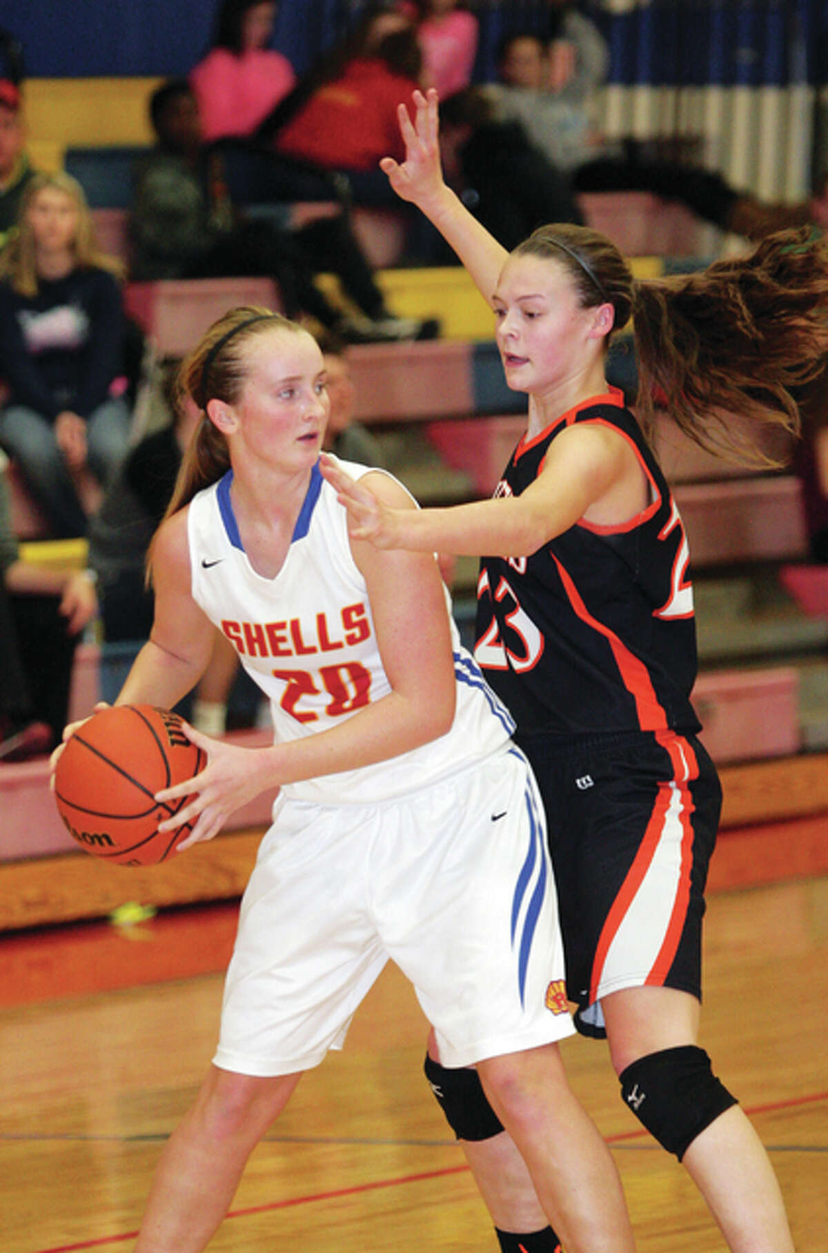 Gillespie’s Bailey Jarman (right) defends while Roxana’s Sara Kreutztrager looks for a teammate during a game Jan. 11 in Roxana. Jarman is the lone senior starter for the 17-8 Miners.