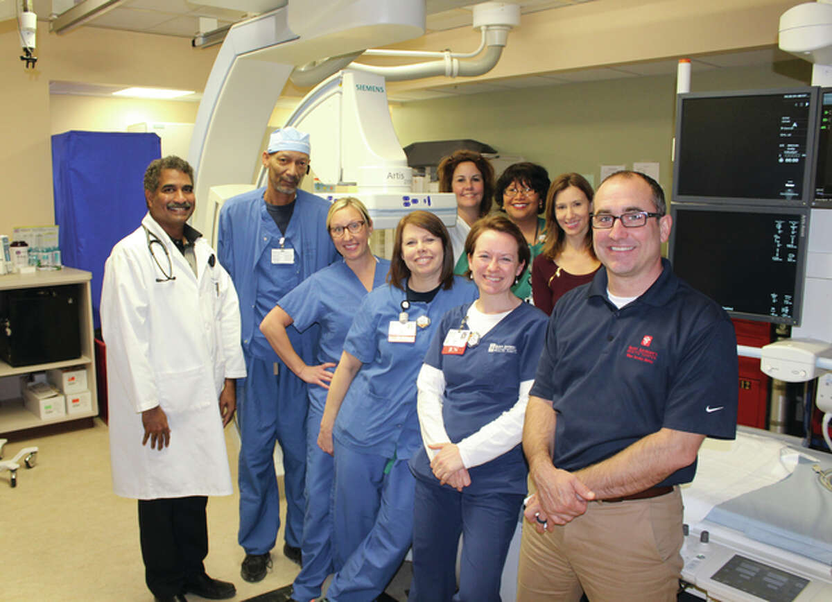 OSF Saint Anthony’s Cardiology Team is recognizing Heart Awareness Month by reminding citizens of the Riverbend to take care of their hearts. Pictured, from left front, are Dr. Rama Gondi, Charles Dickerson, Amber Cearlock, Gail Stephens, Carrie Babor, Greg Schmittling. In the back, from left, are Mary Bartels, Rosalind Brooks and Kelly Keenan.