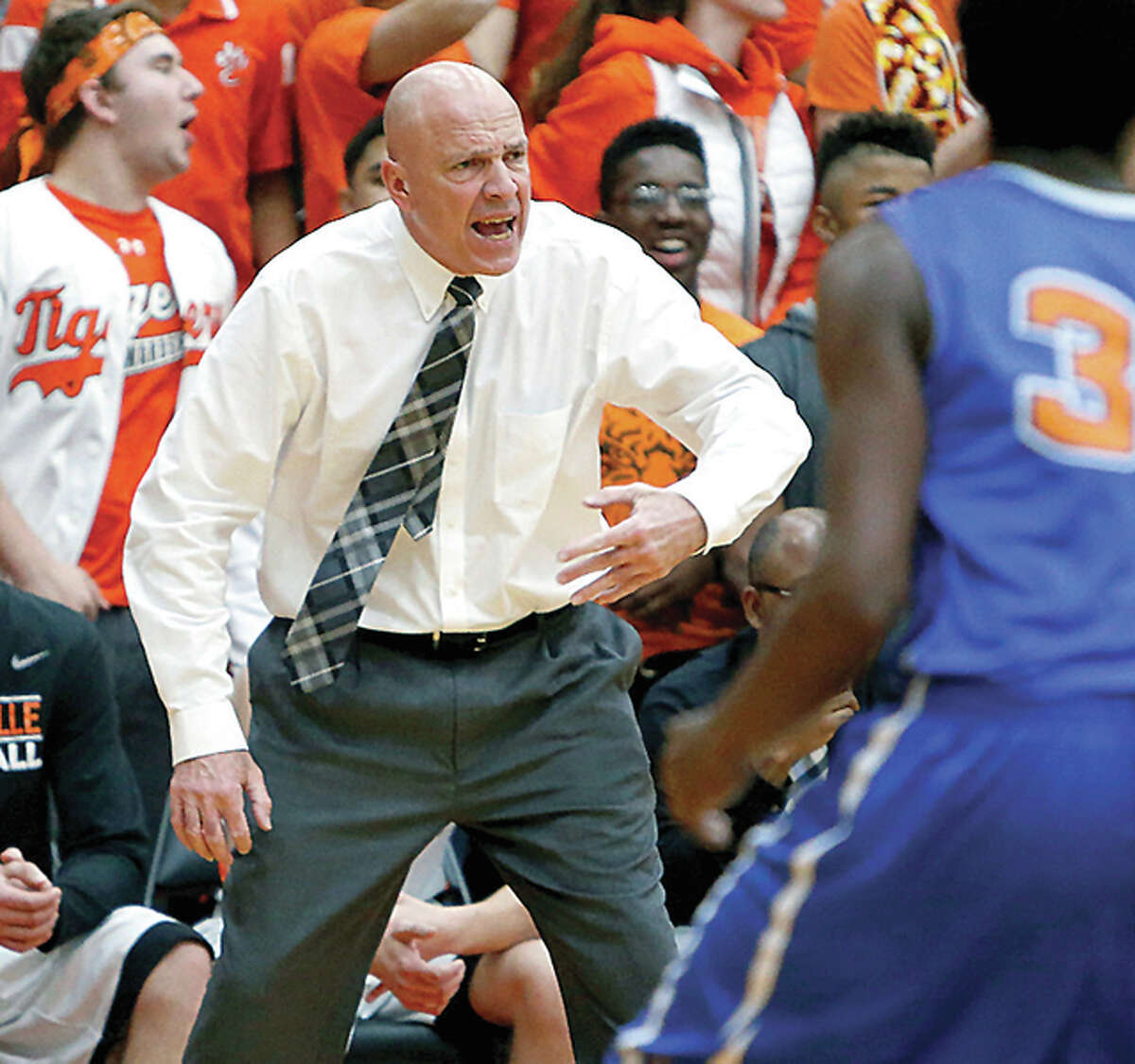 Edwardsville coach Mike Waldo shouts instructions during Friday night’s Southwestern Conference game in Edwardsville.