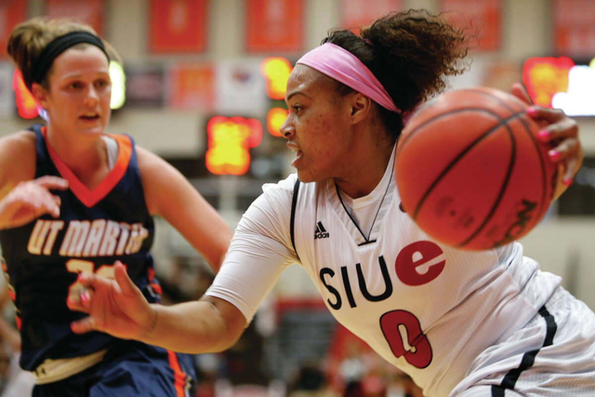 SIUE’s Shronda Butts (right) drives past UT Martin’s Katie Schubert on Saturday at the Vadalabene Center in Edwardsville.