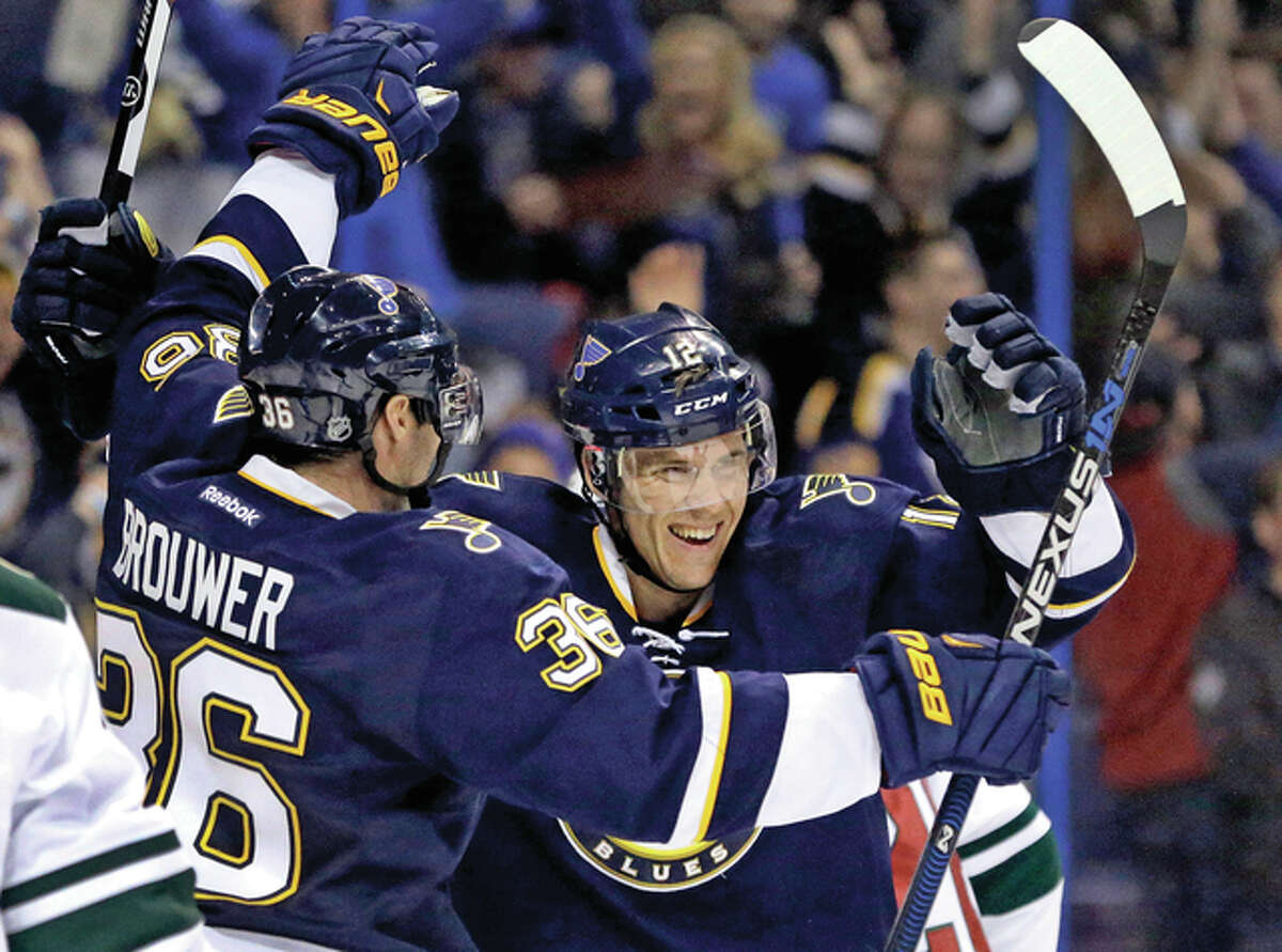 The Blues’ Jori Lehtera is congratulated by Troy Brouwer (left) after scoring during the second period against the Minnesota Wild on Saturday night in St. Louis.