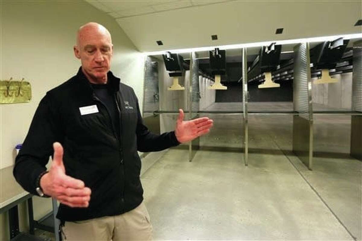 William Basore, co-owner of Centerfire Shooting Sports, talks during a tour of the shooting range and firearms company in Olathe, Kan., Monday, Feb. 8. Basore said he tried to insure his new car under a commercial policy he was originally given while running a construction company, but that he was denied coverage last fall because of his gun business.