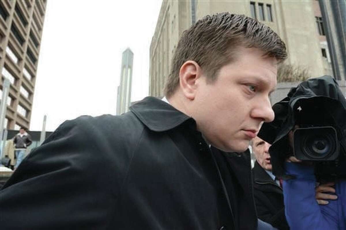 In this Dec. 29, 2015, file photo, Chicago Police Officer Jason Van Dyke leaves the Criminal Courts Building in Chicago after pleading not guilty to murder charges in the 2014 shooting of 17-year-old Laquan McDonald. For more than a year after Van Dyke killed McDonald, the Chicago Police Department had video footage and autopsy results that raised serious questions about whether other officers on the scene tried in their reports to cover up what prosecutors now contend was murder. The lack of swift action against the officers illustrates the difficulty of confronting the code of silence that has long been associated with police in Chicago and elsewhere.