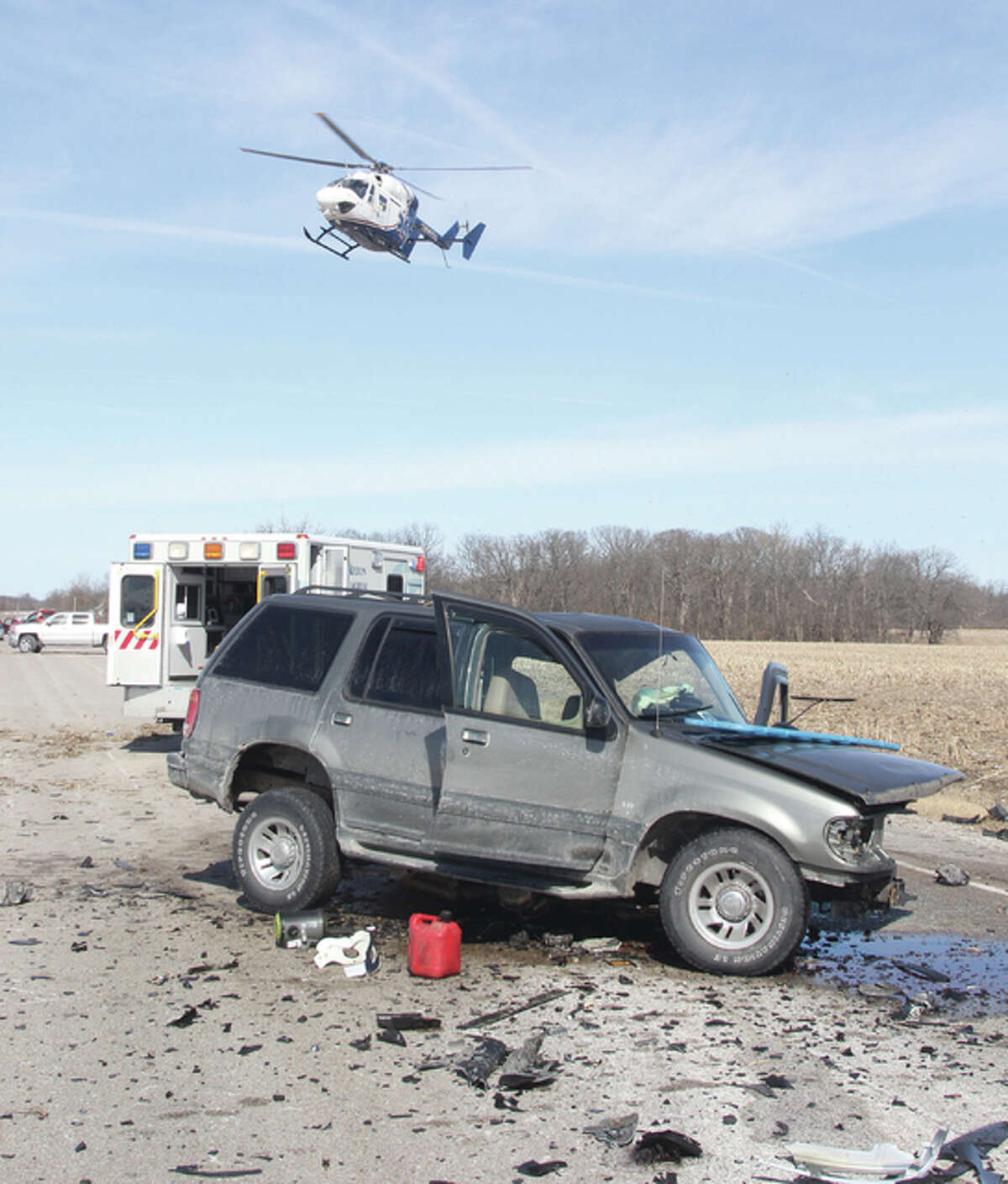 A helicopter takes off from the scene of a head-on collision on Fosterburg Road early Saturday afternoon.
