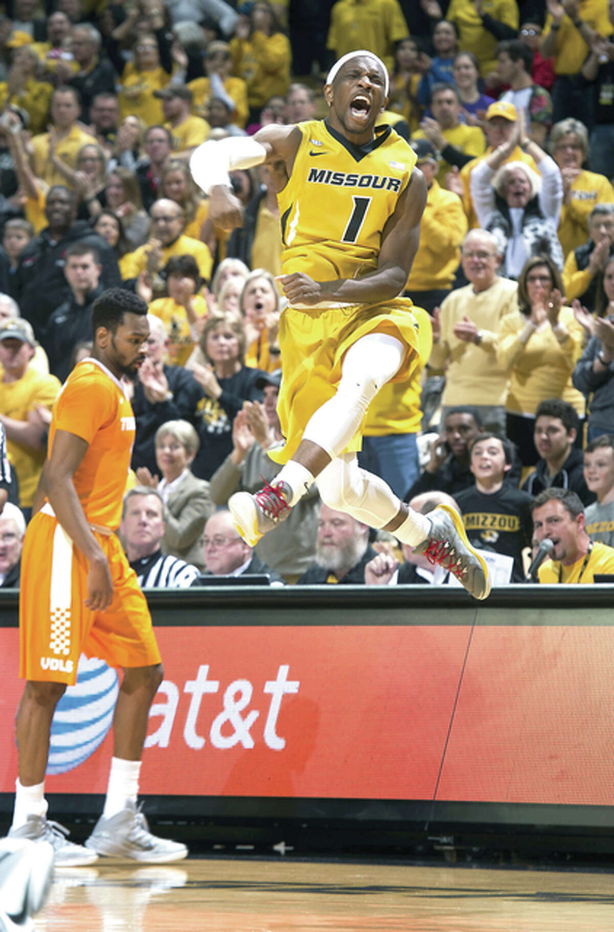 Missouri’s Terrence Phillips, right, celebrates a basket in front of Tennessee’s Kevin Punter, left, Saturday in Columbia, Mo. Missouri won the game 75-64.