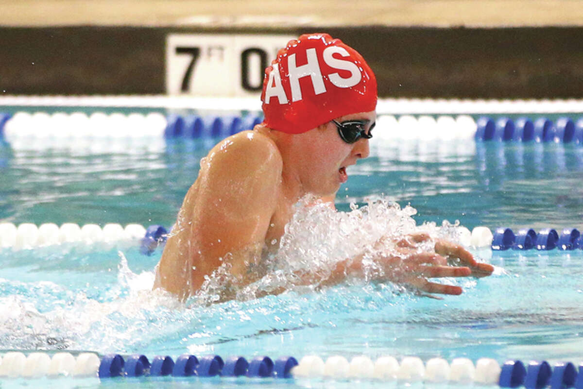 Alton’s Aiden Napp competes in the 200 medley relay at Saturday’s sectional meet at the Chuck Fruit Aquatic Center in Edwardsville.
