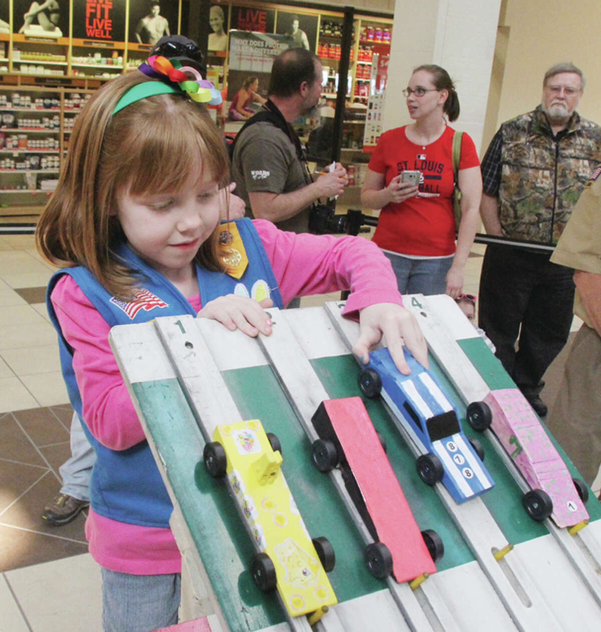 Alexis Peal sets up her pinewood derby car up for racing Saturday at Alton Square.