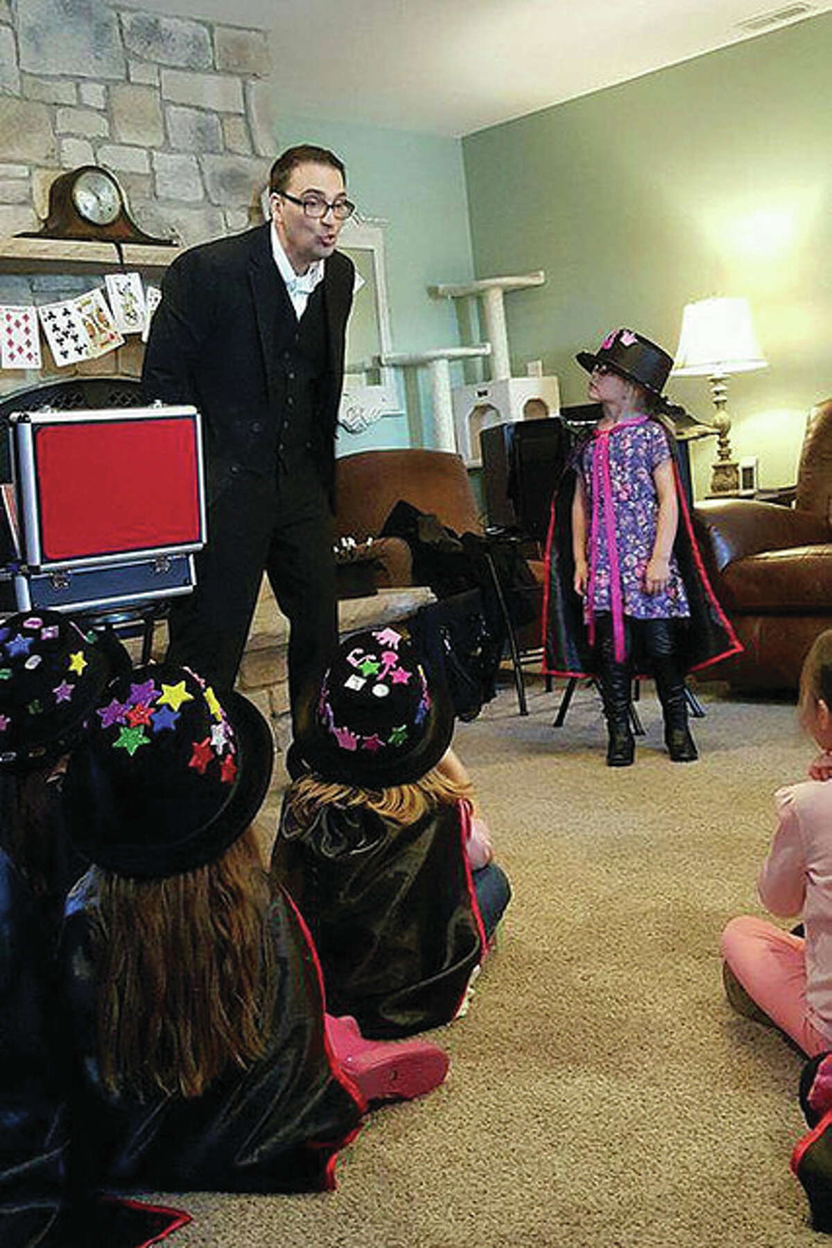 Magician Chris Carpunky performing at a birthday party in High Ridge, Missouri, for a youngster, Maeleigh, who turned 6.