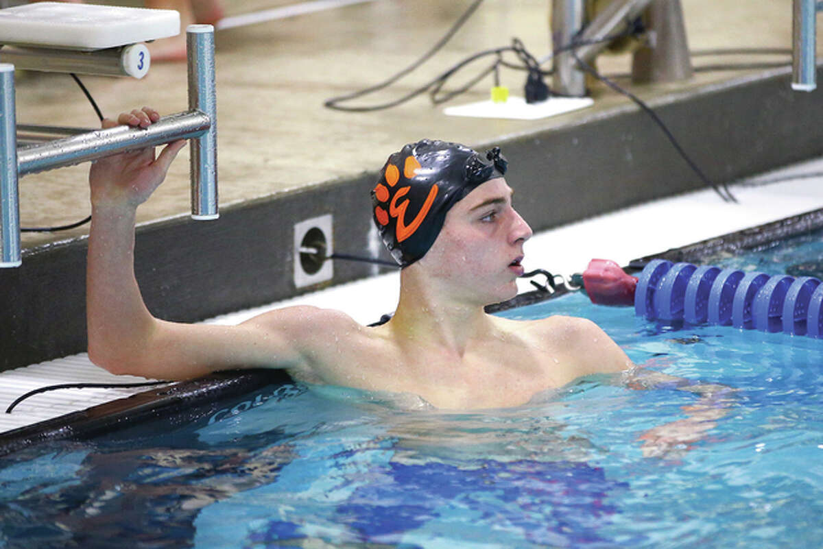 Edwardsville’s Brian Baggette looks at the scoreboard to see his time at the completion of the 500-yard freestyle during Saturday’s ISHA Sectional at the Chuck Fruit Aquatic Center in Edwardsville. Baggette won the event in 4:42.46 to advance to the IHSA Boys State Meet which begins Friday in Evanston.