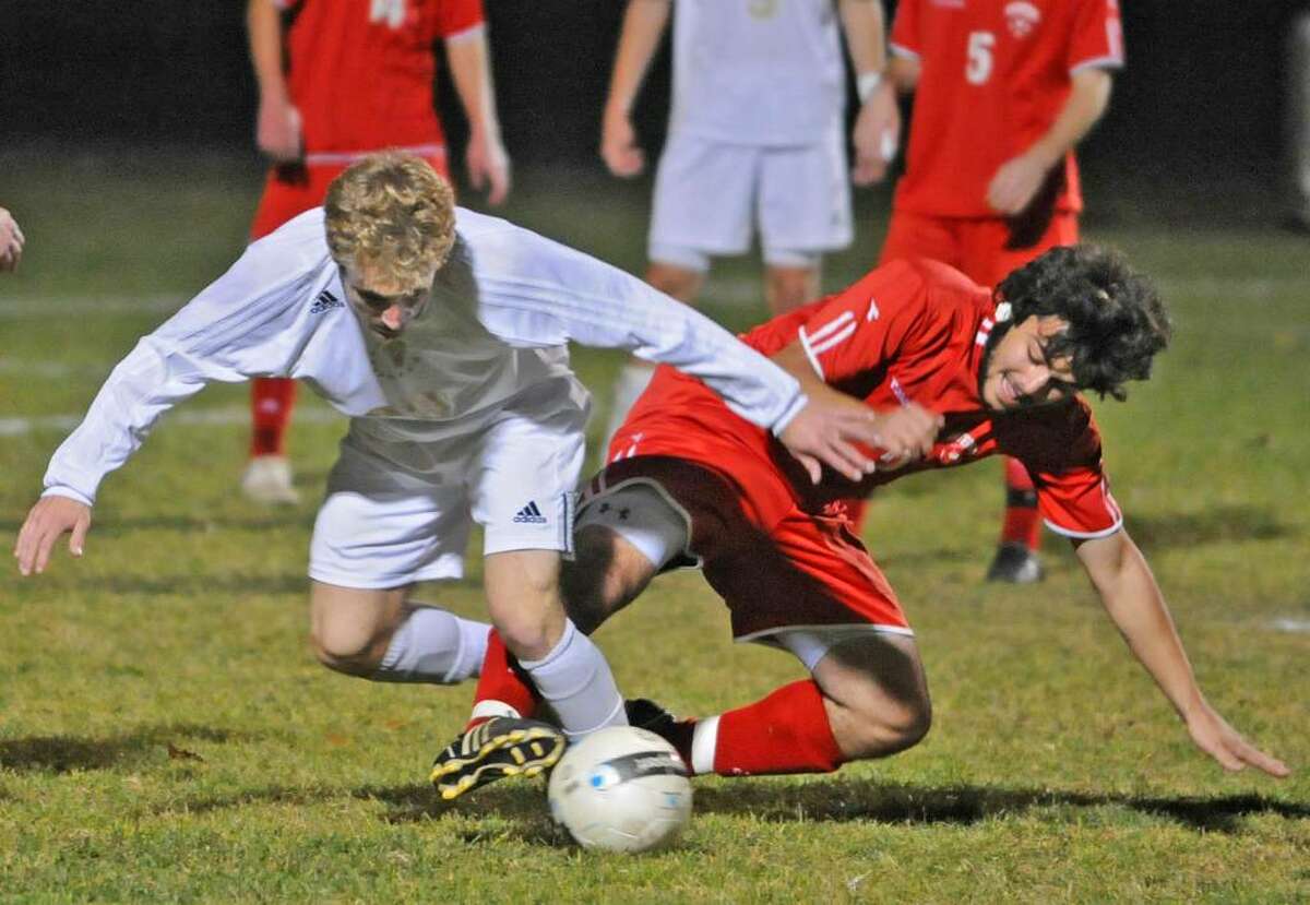 From left, Joe Cillis, of Voorheesville, and Nick Forget, of Waterford, battle for the ball during the Class CC/C boys' soccer playoff held in Colonie. (Lori Van Buren / Times Union)