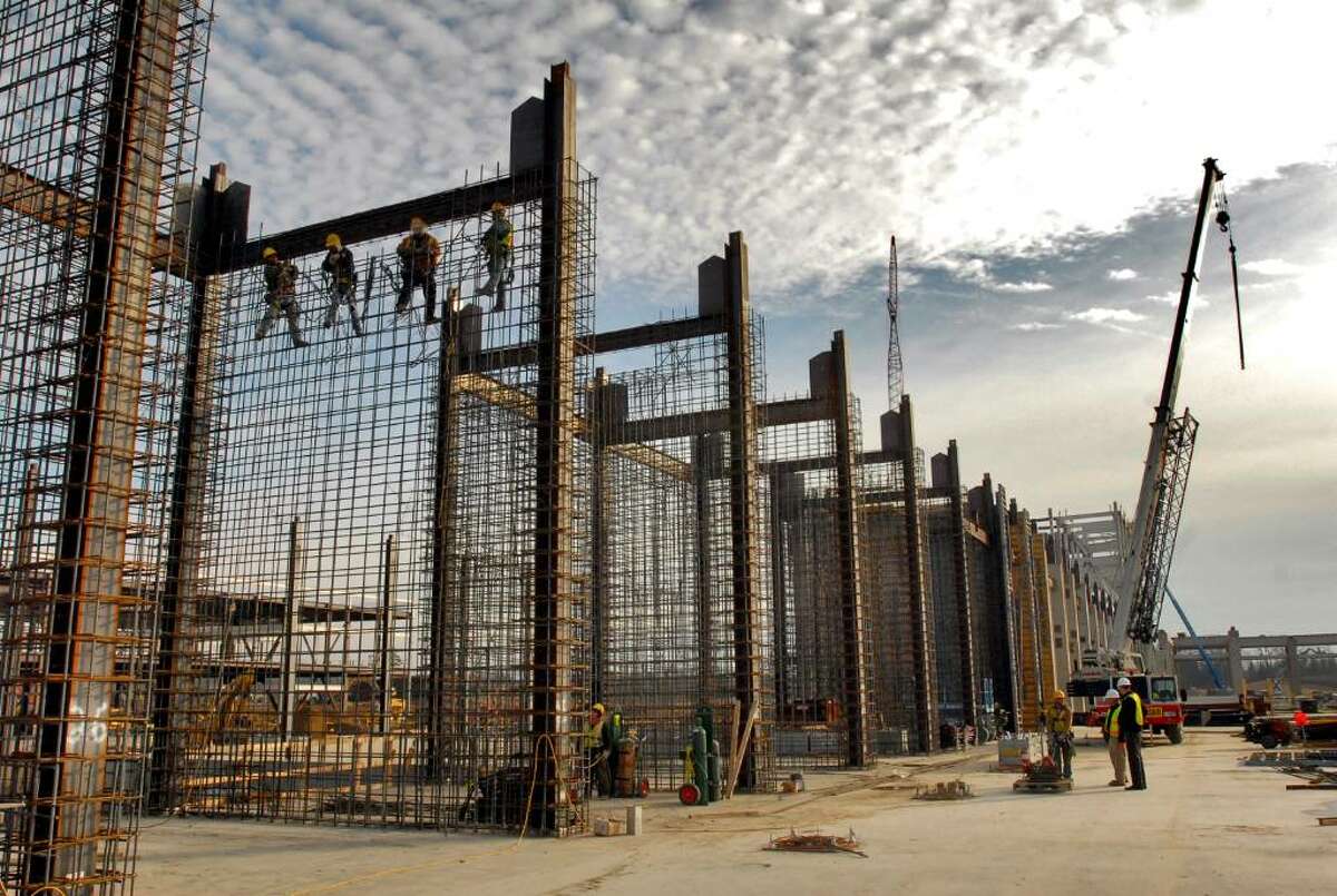 Ironworkers install rebar before concrete is poured for sheer walls, part of the bracing for the building, at the GlobalFoundries Fab 2 Module 1 site chip fabrication plant under construction at the Luther Forest Technology Campus in Malta, NY on Wednesday December 2, 2009. The walls are 35 feet high. (Philip Kamrass / Times Union)
