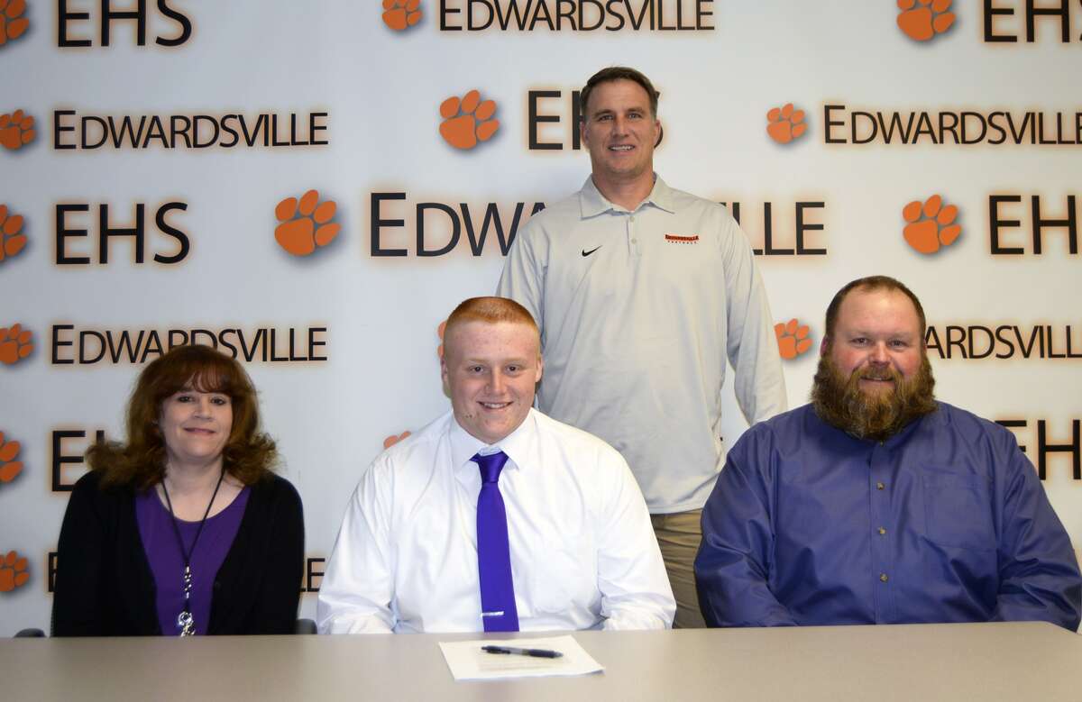 EHS senior Jacob Stellhorn, seated center, will play football for McKendree University. He is joined by his parents Shawn and Rebecca. Standing is EHS coach Matt Martin.