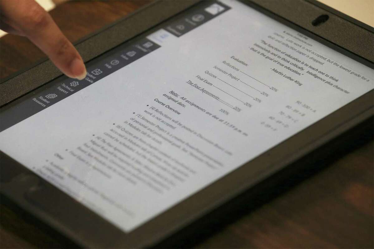 A Memorial High School freshman in an early college program fills out a college questionnaire on a smart tablet last January. The Edgewood ISD program, which lets students earn 60 hours of college credit, is part a ramp-up in recent years of similar offerings by most school districts in Bexar County. (Kin Man Hui/San Antonio Express-News)