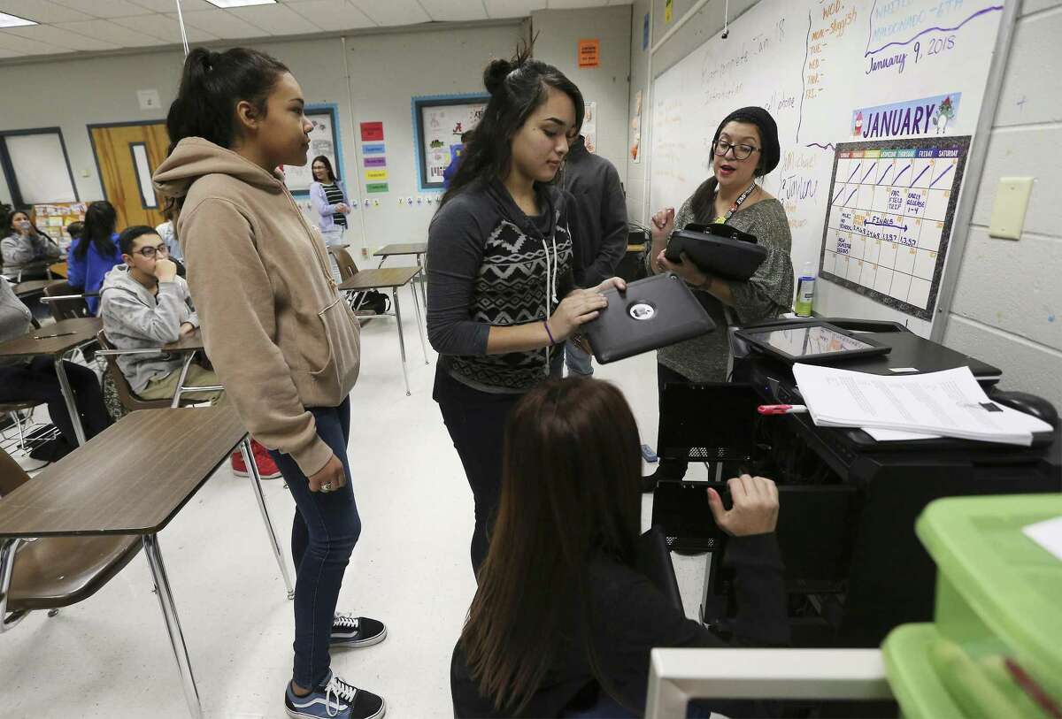 Memorial High School freshmen pick up smart tablets for their college coursework in January. The students take part in an early college high school program where they earn over 60 hours of college credit while still attending high school. More sustained state funding is needed, however.