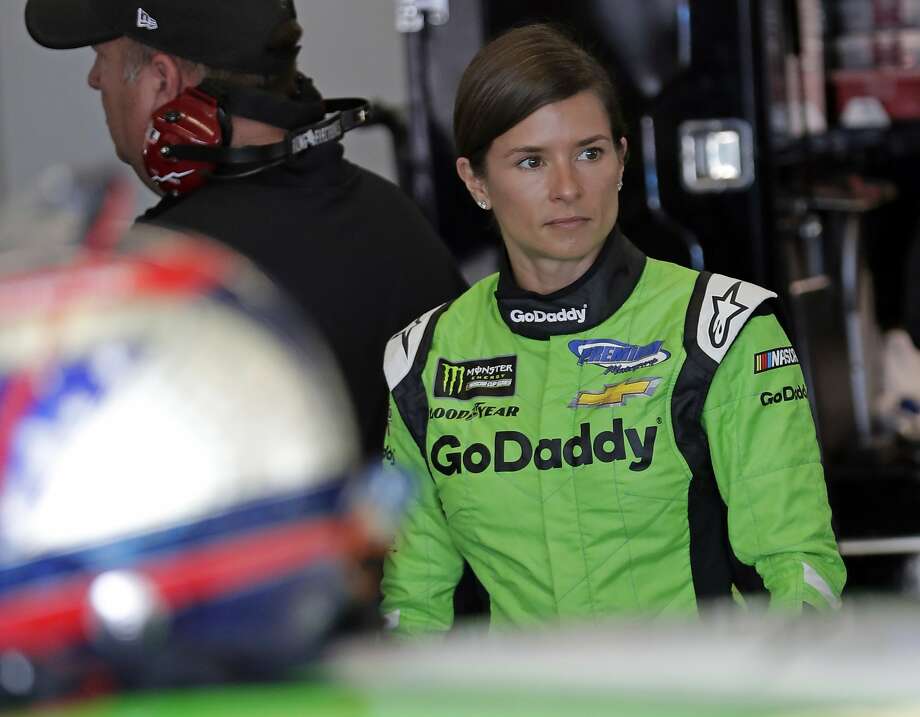 Danica Patrick looks over her car before a practice session Saturday. She will retire after the Indianapolis 500 in May. Photo: John Raoux, Associated Press