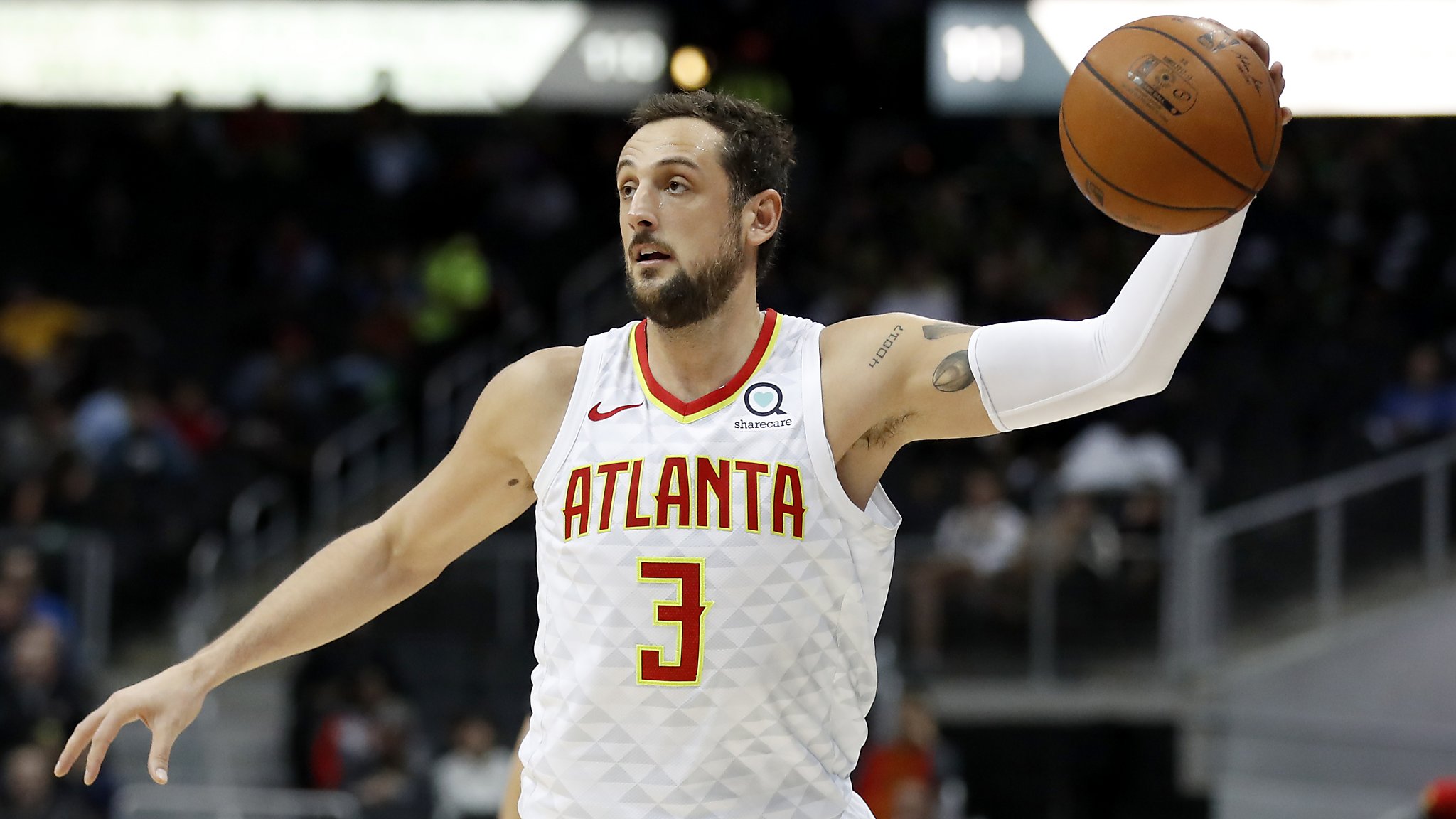 Atlanta Hawks guard Marco Belinelli (3) goes high to pass while