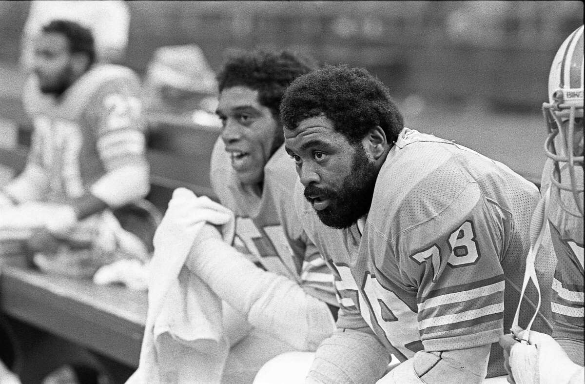 09/28/1975 - Houston Oilers Elvin Bethea (65) and Curley Culp (78) take a breather on the bench in the Astrodome.