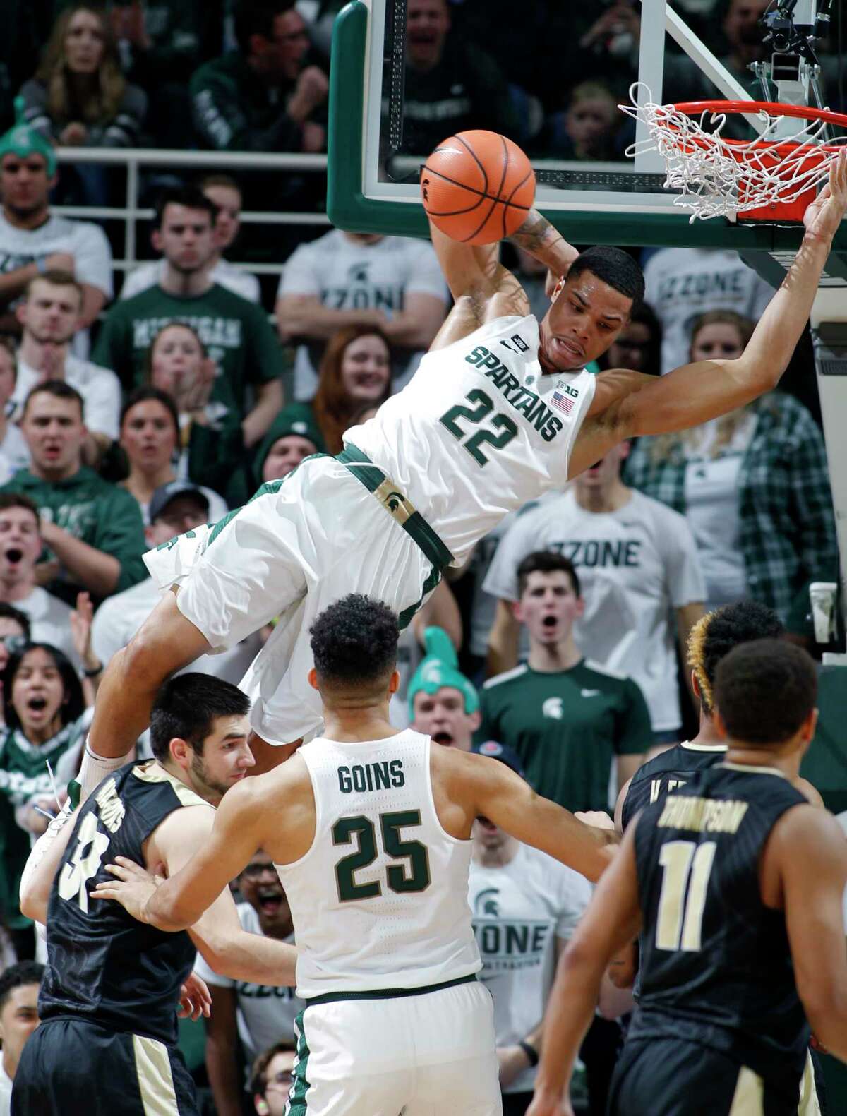 Michigan State's Miles Bridges tries to make a safe landing after dunking in Saturday's victory over Purdue.