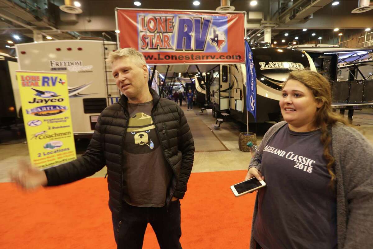 Chris Veum and his daughter Simone talk about being the only family still living in their neighborhood at the Houston RV Show Sunday, Feb. 11, 2018. Verum and his family have been living in an RV in their driveway since Hurricane Harvey hit. The Houston RV Show is now the largest in Texas with over 600 units on display. This includes Motorhomes, Travel Trailers, Tent Campers, Fifth Wheels, and Van Conversions. Recreational Vehicle related vendors representing campgrounds, resorts, parks and RV supplies.