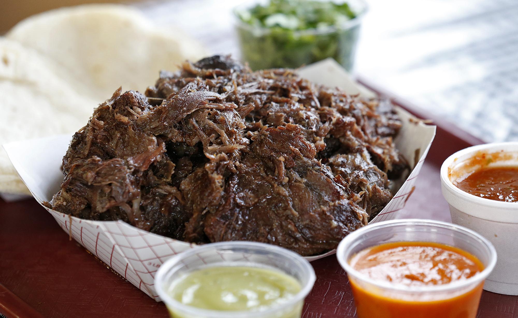 Along the Texas border with Mexico, barbacoa de cabeza en pozo, or beef hea...