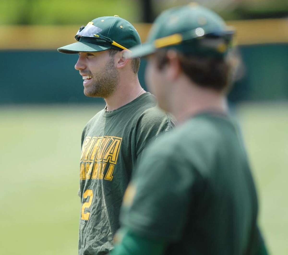 Siena baseball player Dan Paolini, left, takes part in practice at Siena College. Paolini has set a new school record with 22 home runs this year. He leads the entire country in home runs per game. (Paul Buckowski / Times Union)