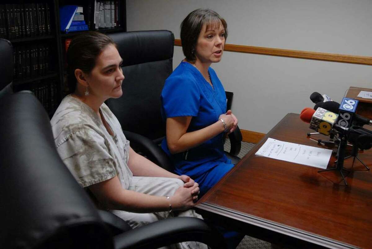 Albany Medical Center registered nurses, Kathryn Dupuis, left, and Lorna Patterson, right, discuss their opposition to the swine flu vaccine mandate, during a press conference at their lawyer's, Terence Kindlon, office on Monday, Oct. 12, 2009. (Paul Buckowski / Times Union)