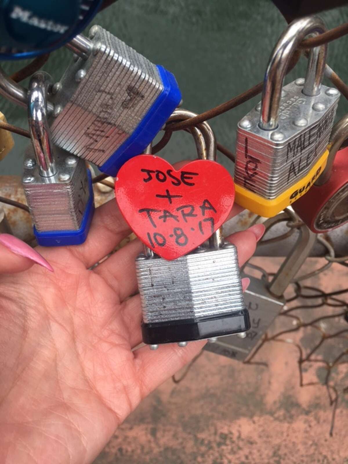 The love lock bridge, which the Shavers say they had a hand in starting, is outside the Courthouse Wedding Chapel at 126 East Main Plaza.