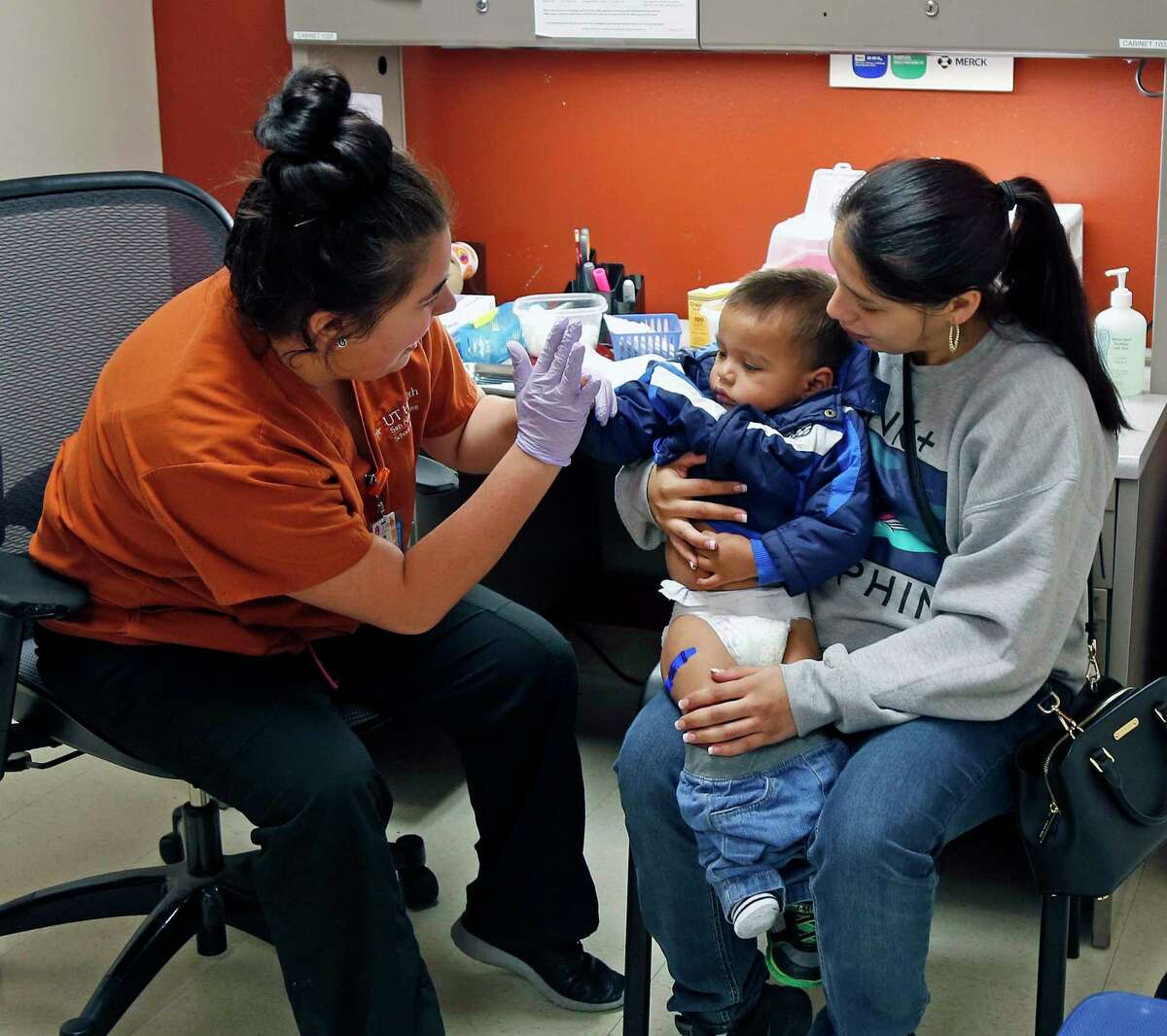The pandemic has changed how nursing is taught, and students are helping with COVID-19 screening. Here, a nursing student with UT Health San Antonio in 2018 gives a flu shot to a child.