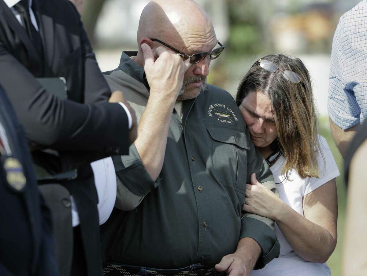 Pastor Frank Pomeroy and his wife Sherri join a news conference near the First Baptist Church of Sutherland Springs on Nov. 6, 2017. A man opened fire inside the church in the small South Texas community on Sunday, killing and wounding many. The Pomeroy's daugher, Annabelle, 14, was killed in the shooting. (AP Photo/Eric Gay)